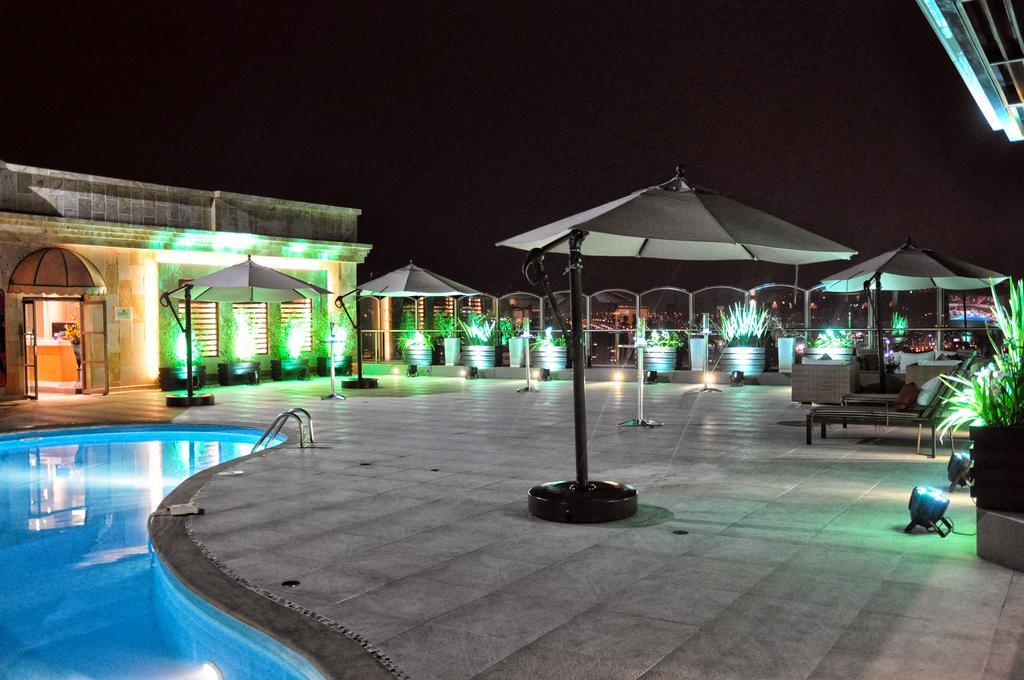 Hotel Dann Carlton بوكارامانغا المظهر الخارجي الصورة The pool at the rooftop